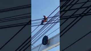 Greasing crane wires. 