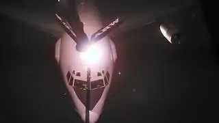 USAF KC-135 Stratotanker night refueling an E-3 Sentry over Middle East