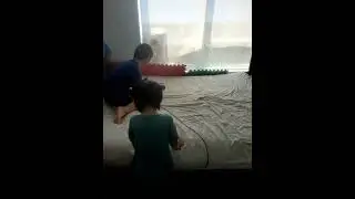 James Cheng and Jacqueline Cheng helping out with house chores vacuum bed
