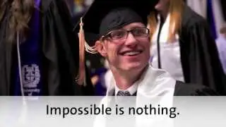 University of Portland student Sam Bridgman walks across the stage at graduation