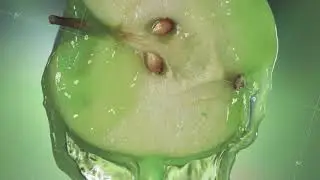 Flowing Green Apple Juice from half Apple , macro shot in slow motion