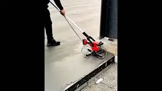 Creative tool of construction worker screeding cement flooring