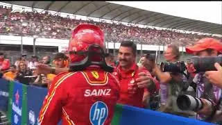 A single Ferrari team member waiting for Carlos Sainz after achieving pole position