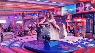 Pretty Girl in Beautiful Dress Riding on a Bull in Benidorm   Mechanical Bull 4K  Epic Fail August