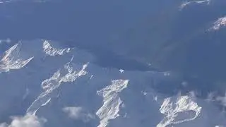 Views of the Alps as we fly above the snow capped peaks