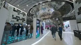 Business professionals walking in a modern exhibition hall