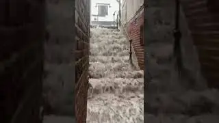 Heavy rain in Guildford turns stairs into 'waterfall'