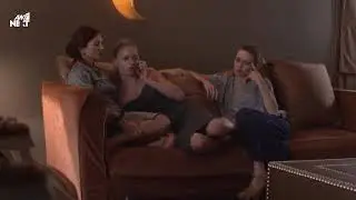 Two women barefeet on couch