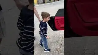 this little kid wanted to see this luxury car from inside