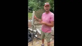 When installing an above ground swimming pool on a windy day using a fence post