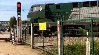 Freight Train Passing Railway Crossing in Rural China