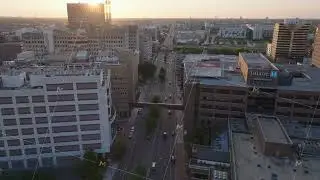 Aerial view of a city street of downtown new orleans at sunset. Cars running in town and urban