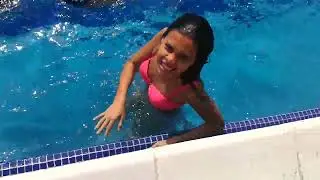 She has lots of fun in the pool