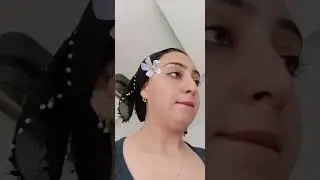 Hijab-wearing woman gives a revealing glimpse of her cleavage on TikTok live stream.
