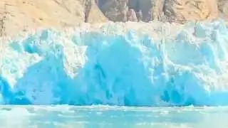 Massive Glacier Calving creating huge blue ice wall   Great event worth watching