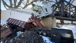 STEAM TRAIN CRASHES OFF BRIDGE