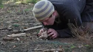 Making a fire with steel and flint.