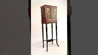 A delicate Regency Chinoiserie lacquer cabinet