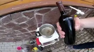 Sealing wine bottles with a cork stopper and a thermal cap.