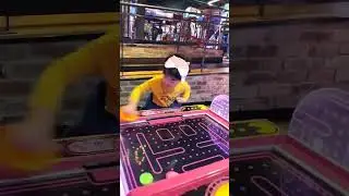 4 year old playing air hockey - 042023