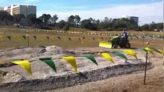 Deere x758, x738, and x534 pushing stone