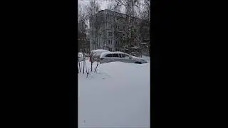 город занесенный снегом