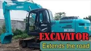 Excavator extends the road