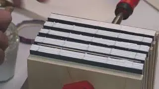 Lining the spine of a group of books.