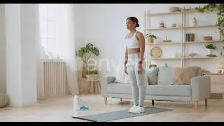 Domestic Stretching Workout. Young Flexible African American Lady Tilting at Home, Reaching To F...