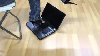 Girl trample laptop with sexy high heels in my office