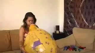 Blow to pop a yellow balloon