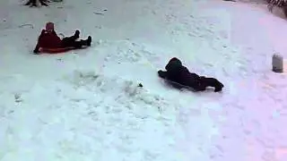 Evie and Tony sledding