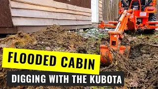 Digging a MOAT to drain around my off grid cabin with the Kubota BX23s - Part 1