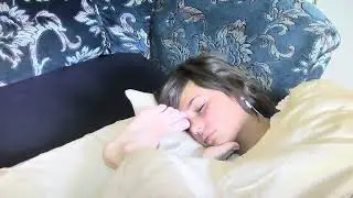 Three sleeping girls touch each others faces with feet