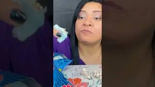 Trying cotton candy with popcorn