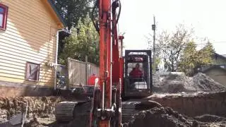 expert operater digging basement HD