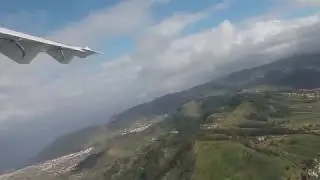 Flying from Tenerife to Gran Canaria. Volcano Teida breaks through the clouds.