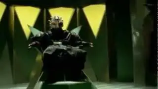 Mesogog inhales Broly's voicebox while smashing Lothor's face into the Sun