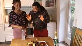 Flipping the bottle game with chicken wings and plantain