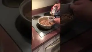 Adding beef stock, tomato paste, dry oregano and seasoning