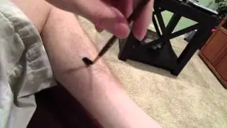 Feet tickling with brush