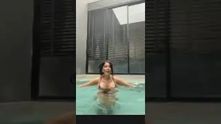 Sexy girl making pool waves