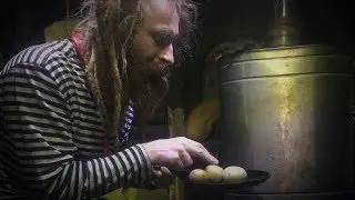 A hermit in a dugout fries potatoes