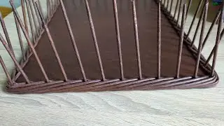 We braid a rectangular plywood bottom with a ROLLER made of newspaper tubes