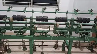 Cone winding machine for making large packages to small packages.