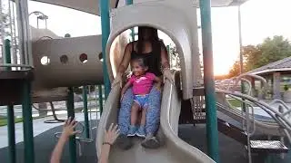 Camila and mom going down the slide