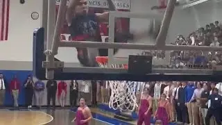 Detroit Pistons Xtreme Team smashes backboard during St. Francis pep rally