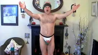 Sing happy birthday in welsh, wearing only a thong and wooly hat