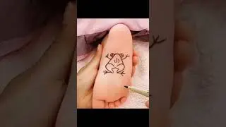 Frog Drawing on baby foot while sleeping