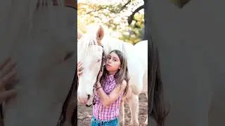 Playing with horses. Photography in the countryside.  Girl's portrait.